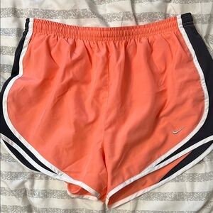 Nike Orange and Black Athletic Shorts with Curved Hem